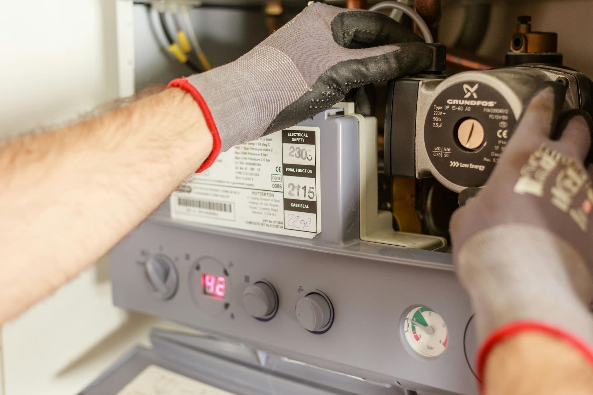 An engineer inspecting a domestic boiler